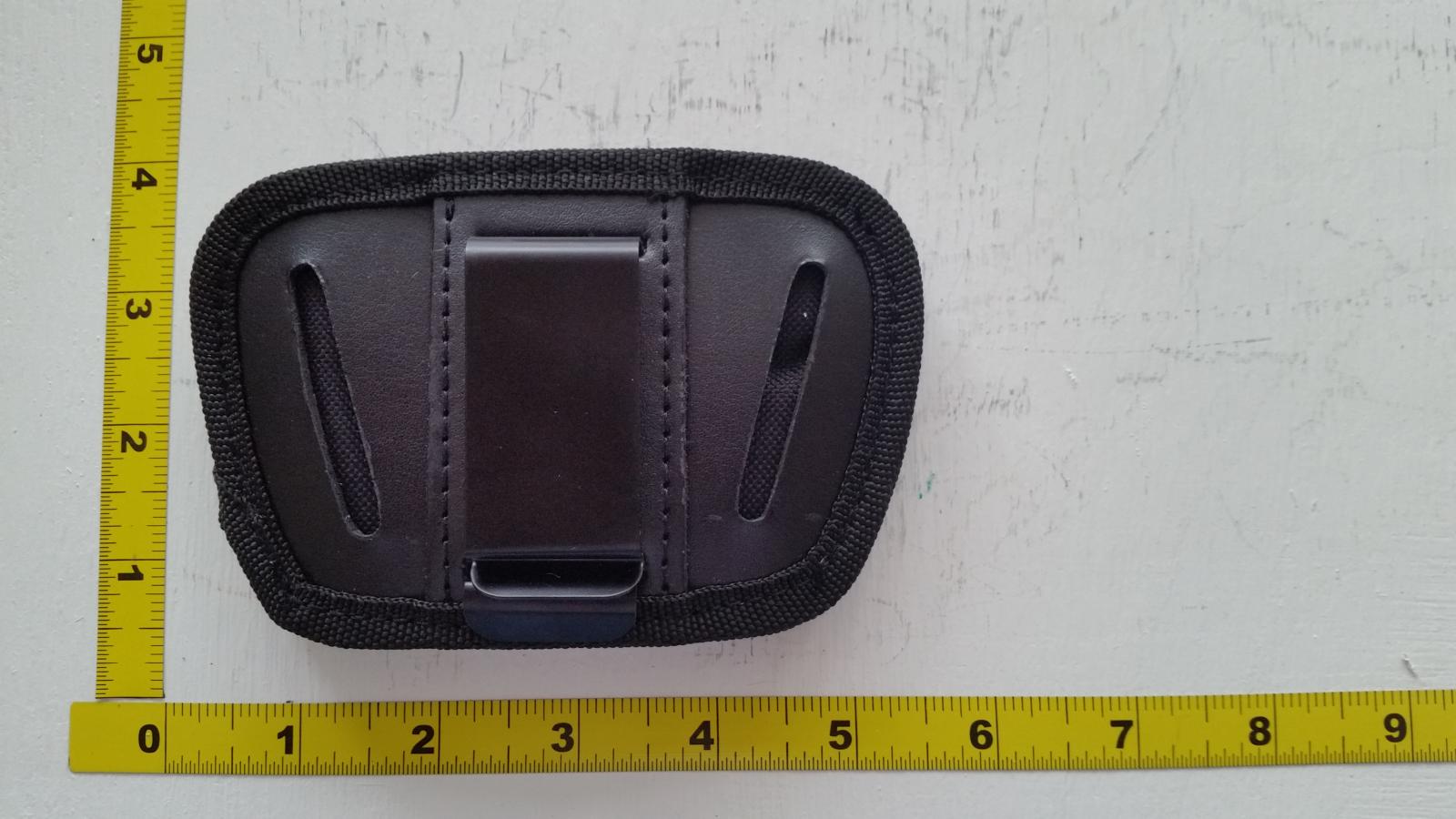 5" Black Leather Holster. Clip on belt or remove clip and thread onto belt through loops.